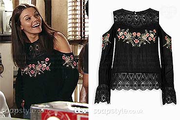 Kate Connor (Faye Brookes) wearing a black cold shoulder top with flowers on TV in Coronation Street
