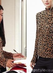 Alya Nazir wearing an animal print top with turtle neck on TV in Coronation Street